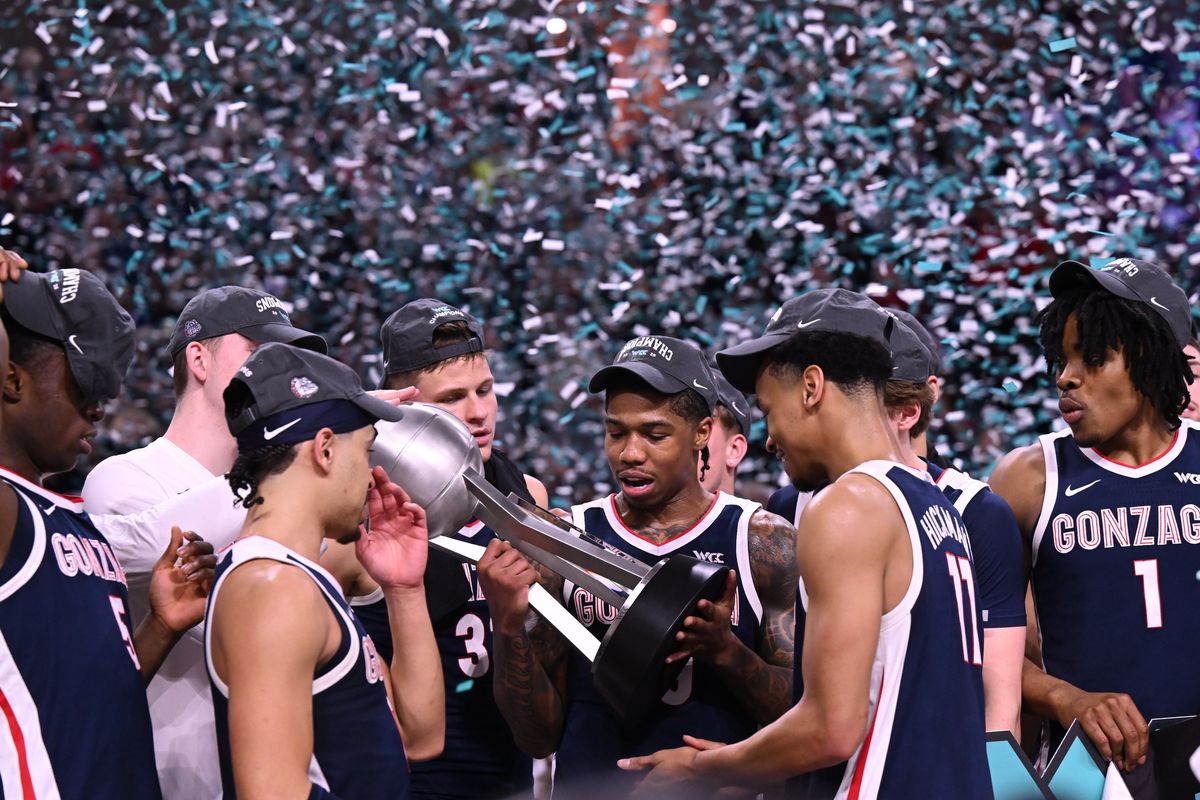The Gonzaga Bulldogs check out the WCC trophy after GU defeated the Saint Mary