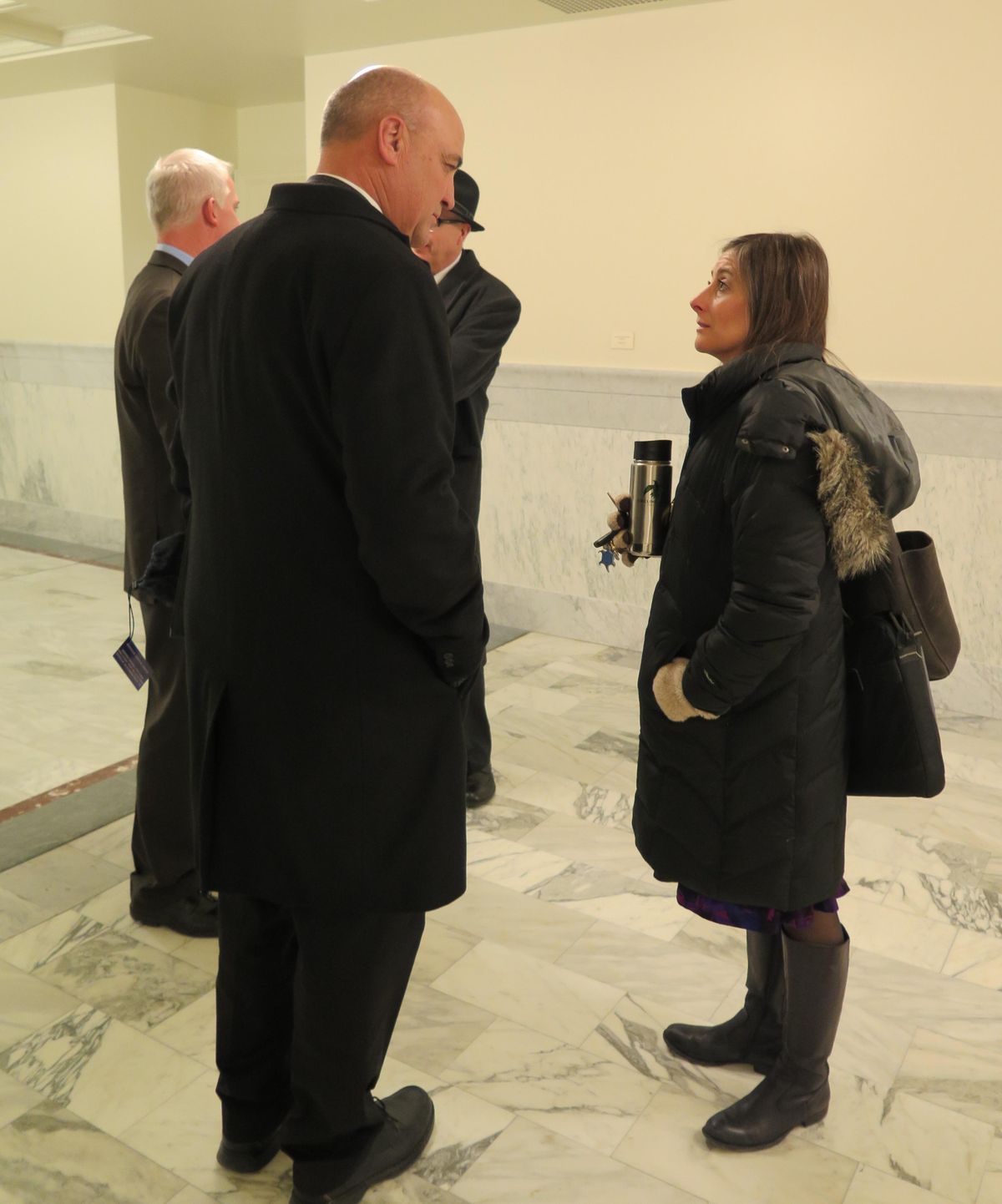 Rep. Heather Scott, right, visits with new House Ethics Committee Chairman Van Burtenshaw, R-Terreton, in a friendly exchange in a Capitol corridor before leaving the Statehouse on Wednesday evening Jan. 18, 2017. (Betsy Z. Russell / SR)