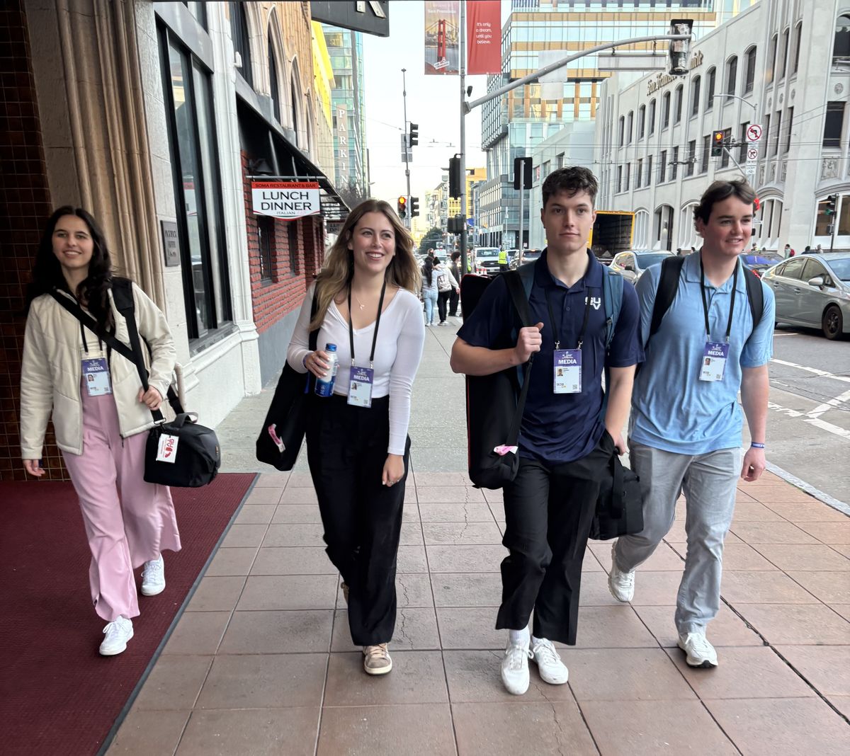 Gonzaga seniors, from left, Natalie Keller, Madylin Campbell, Michael Hanrahan and Kyle Sweeney walk down the street with their press gear and media passes this week in the Bay Area to cover the lead up to the Super Bowl.  (Courtesy of John Collett)