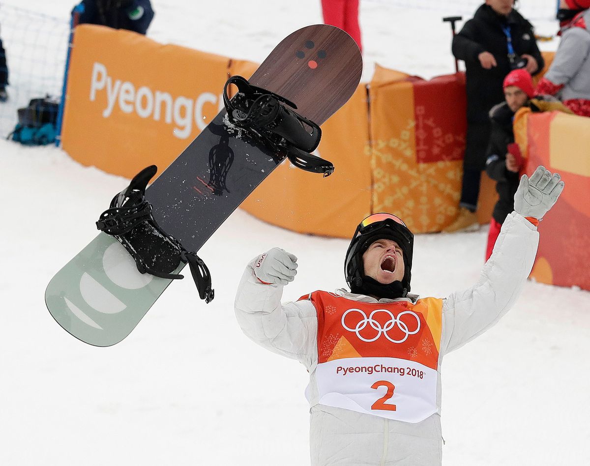 FILE - Shaun White, of the United States, celebrates winning gold after his run during the men