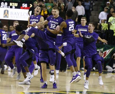 Kansas State forward Dean Wade (32) and forward Wesley Iwundu, right, react to their win over No. 2 Baylor on Saturday. (Rod Aydelotte / Associated Press)