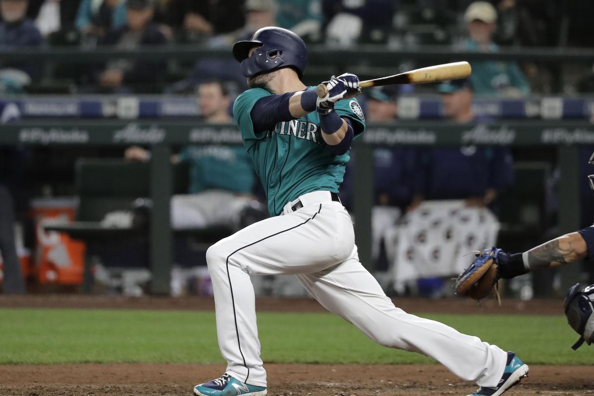 Seattle Mariners’ Mitch Haniger follows through on his walk-off home run against the Tampa Bay Rays during the 13th inning of a baseball game, Friday, June 1, 2018, in Seattle. The Mariners won 4-3 in 13 innings. (Ted S. Warren / Associated Press)