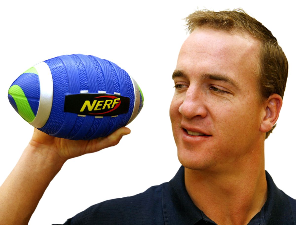 Indianapolis Colts quarterback Peyton Manning holds a Nerf Peyton Manning Pro Grip Football. With parents facing tough choices about how much to spend, tried-and-true toys are being seen as affordable, safe bets by parents and toy makers.Associated Press file photos (Associated Press file photos / The Spokesman-Review)