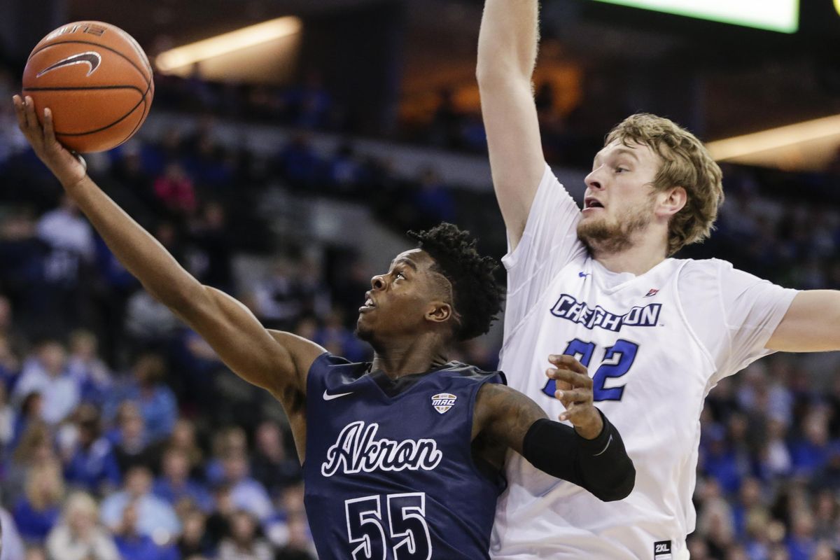 Akron’s Antino Jackson (55) goes to the basket in front of Creighton’s Toby Hegner (32) during the first half of an NCAA college basketball game in Omaha, Neb., Saturday, Dec. 3, 2016. (Nati Harnik / Associated Press)