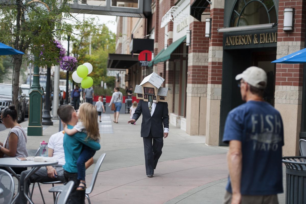 Charlie Schmidt, a Spokane performance artist and Keyboard Cat inventor, demonstrates his latest gag, "the Head Suite" on Tuesday, Aug. 30, 2016, in downtown Spokane, Wash. The house is a spoof of the tiny house movement. (Tyler Tjomsland / The Spokesman-Review)