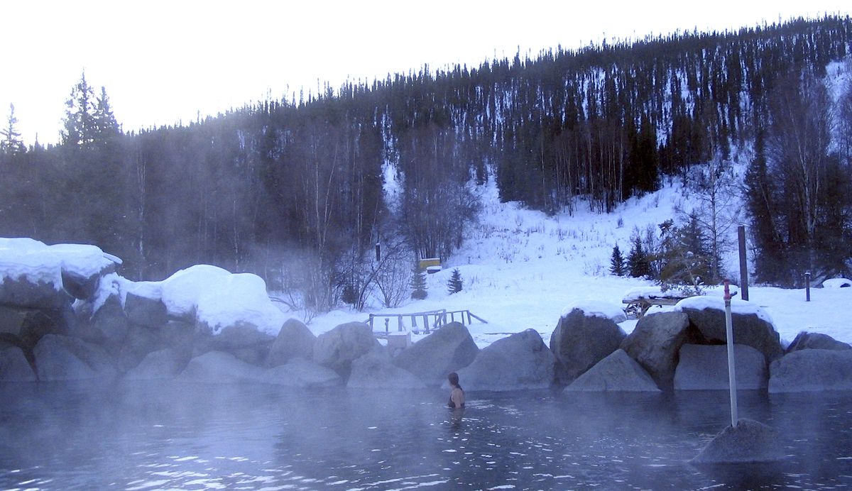 Steam rises from Hot Springs Rock Lake surrounded by the snowy landscape at Chena Hot Springs Resort. (The Spokesman-Review)