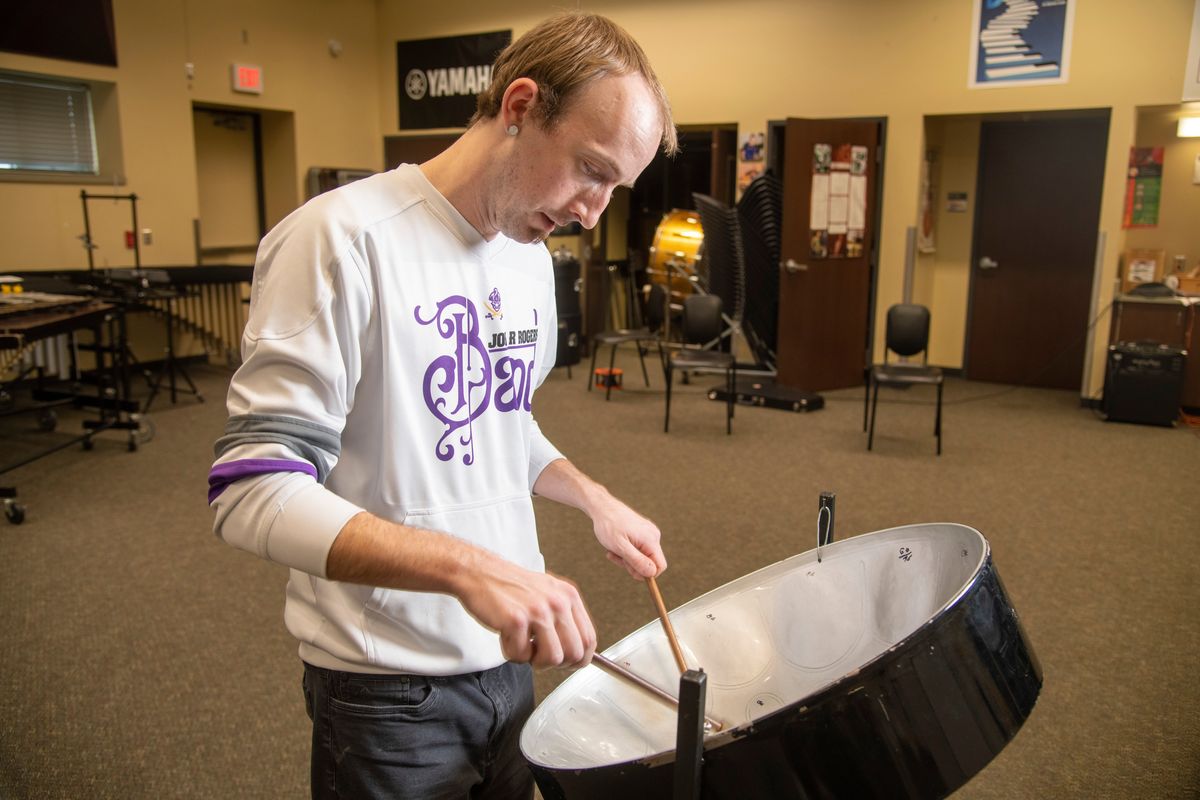 Music teacher Taylor Belote plays on a steel pan drum in his.classroom at Rogers High School Thursday, Dec. 1, 2022. Belote and some other steel pan enthusiasts will play at a Santa Breakfast at the Southside Senior Center. Belote has added steel drums to his classes at Rogers and at Deer Park High when he taught there. The steel pan drums are associated with the Caribbean in general, they are actually from Trinidad and Tobago.  (Jesse Tinsley/THE SPOKESMAN-REVIEW)