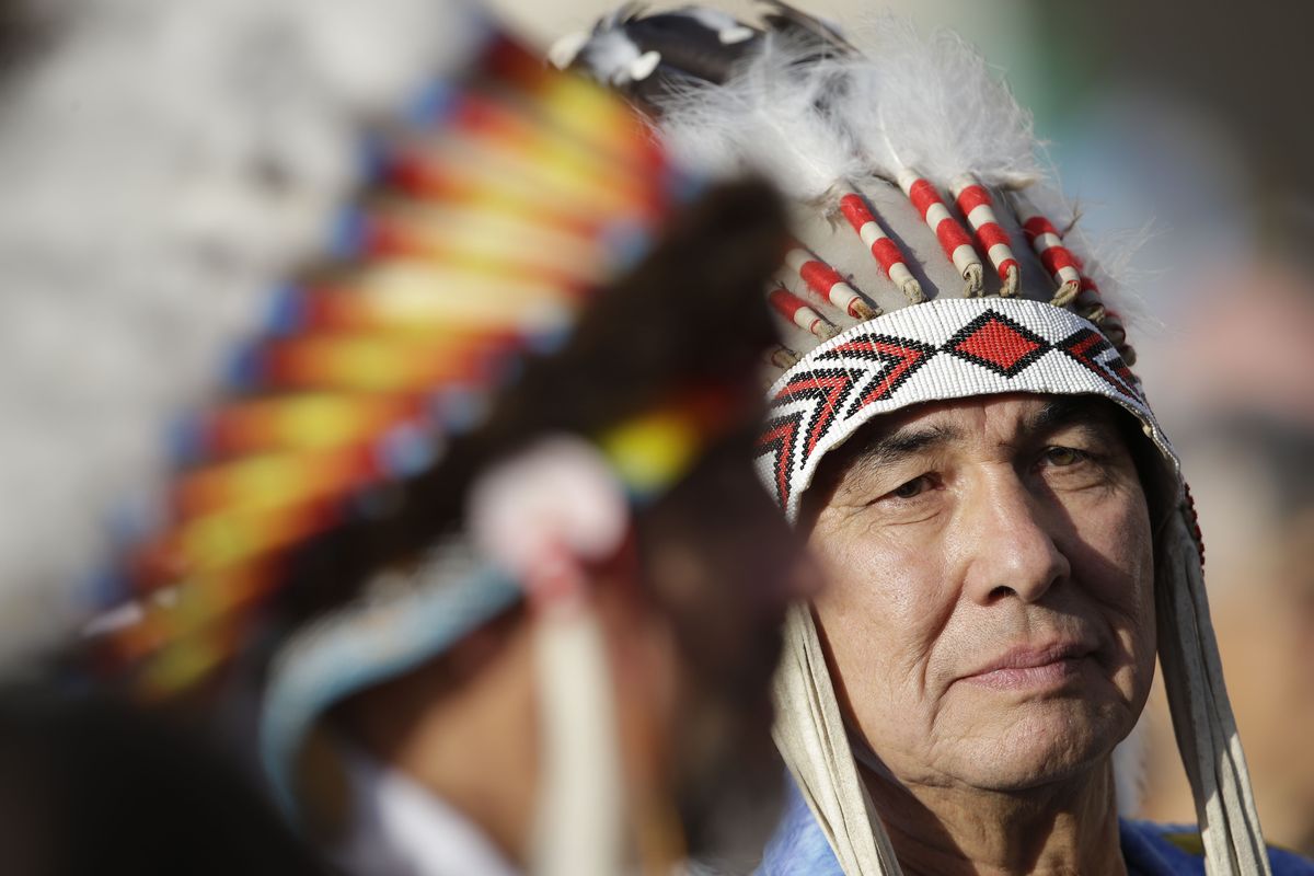 Native Indians wait for the start of a canonization ceremony celebrated by Pope Benedict XVI, in St. Peter