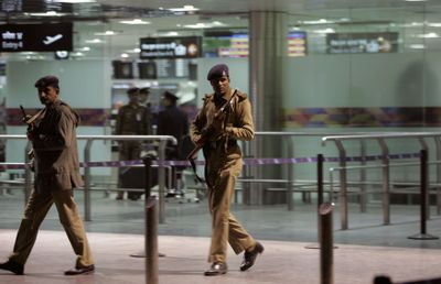 Indian paramilitary soldiers patrol at Indira Gandhi International airport in New Delhi, India, today  after warnings that terrorists planned to highjack an aircraft. (Associated Press / The Spokesman-Review)