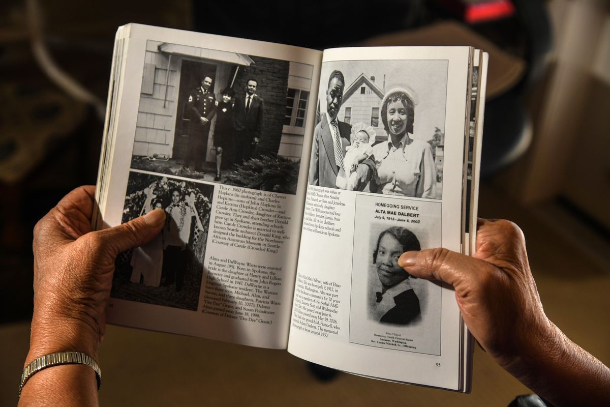 Jerrelene Williamson views a page from her “African Americans in Spokane” book, Wednesday, April 24, 2019, in Spokane Valley. Jerrelene, her husband, Sam, and daughter, Annette are shown in 1951 on the upper right of page 95 in the book. Jerrelene is accepting the Spokane Community Impact award in May for her work chronicling the lives of black people in early Spokane. (Dan Pelle / The Spokesman-Review)