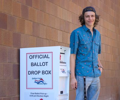James Eberle, 17, standing Friday outside the Central Library, is excited to vote for the first time in the primary election.  (Sidiq Moltafet/The Spokesman-Review)