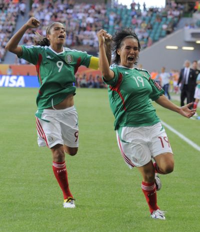 Mexico's Monica Ocampo, right, and teammate Maribel Dominguez celebrate after Ocampo scored Mexico's tying goal. (Associated Press)