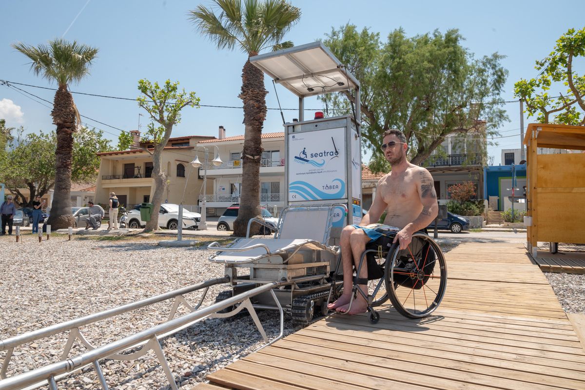 At each site, a wheelchair-friendly wooden walkway leads to a chair set on a single track. Users transfer themselves into the recliner and “drive” into the water. (MUST CREDIT: Seatrac photo)  (SeaTrac/Handout)