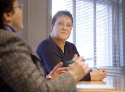 
Donna Flint, right, says she was a victim of job discrimination when she revealed to her employer, The Salvation Army, that she had a physical disability. Flint, seen  Wednesday with her attorney, Donna Beatty, is suing for  discrimination.
 (Ingrid Lindemann / The Spokesman-Review)