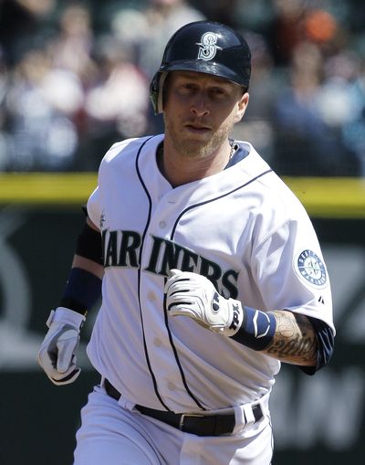 Mike Carp of the Mariners  rounds the bases after he hit a solo home run against the Minnesota Twins in the second inning of Sunday's game.
 (Ted Warren / Associated Press)