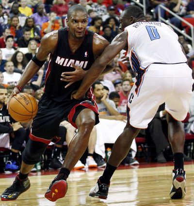 Miami’s Chris Bosh scored 40 points and grabbed 7 boards in a win over Toronto. (Associated Press)