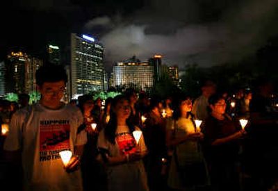 Tens of thousands of people stage a candlelight vigil at Hong Kong's Victoria Park on Saturday to mark the 16th anniversary of the millitary crackdown on a pro-democracy movement on the same day in Beijing in 1989.
(Associated Press / The Spokesman-Review)