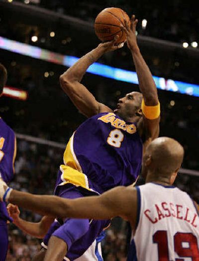 
Lakers guard Kobe Bryant scores the winning basket with 12 seconds left. 
 (Associated Press / The Spokesman-Review)