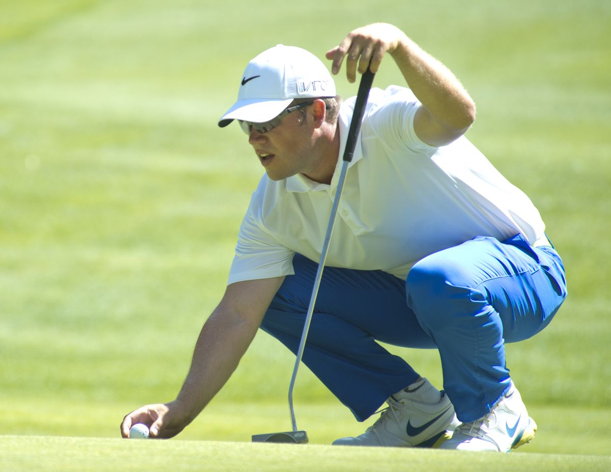 Rosauers Open winner Corey Prugh lines up a putt on the back nine at Indian Canyon. Prugh won by one stroke over Derek Barron. (Jesse Tinsley)