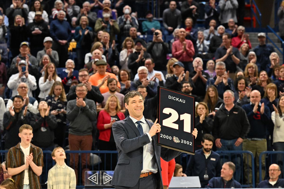 Zags great Dan Dickau acknowledges the crowd as his No. 21 is honored before Thursday’s game at McCarthey Athletic Center.  (Tyler Tjomsland/The Spokesman-Review)