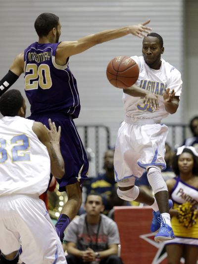 Christopher Hyder, right, and the Southern Jaguars held opponents to 36.5 percent shooting from the floor, including 28.4 percent from 3-point range. (Associated Press)