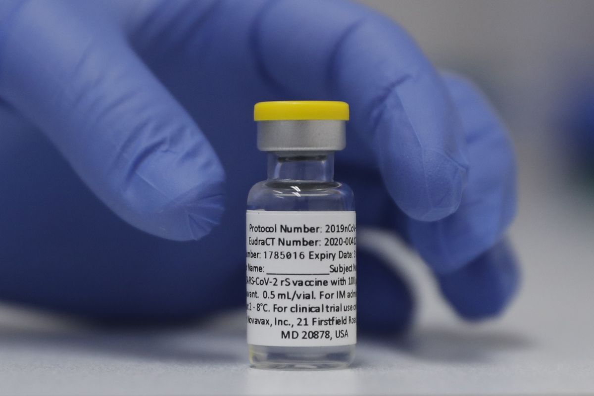 FILE - In this Wednesday, Oct. 7, 2020, file photo, a vial of the Phase 3 Novavax coronavirus vaccine is seen ready for use in the trial at St. George
