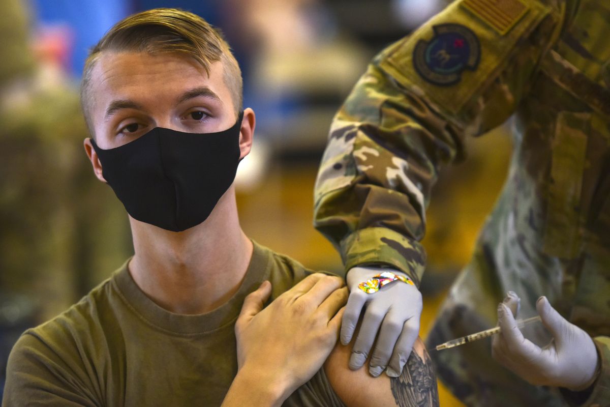 In this Feb. 9, 2021 photo provided by the Department of Defense, Hickam 15th Medical Group host the first COVID-19 mass vaccination on Joint Base Pearl Harbor-Hickam. By the thousands, U.S. service members are refusing or putting off the COVID-19 vaccine, as frustrated commanders scramble to knock down internet rumors and find the right pitch that will convince troops to take the shot. Some Army units are seeing as few as a third agree to the vaccine, others are higher. (Tech. Sgt. Anthony Nelson)