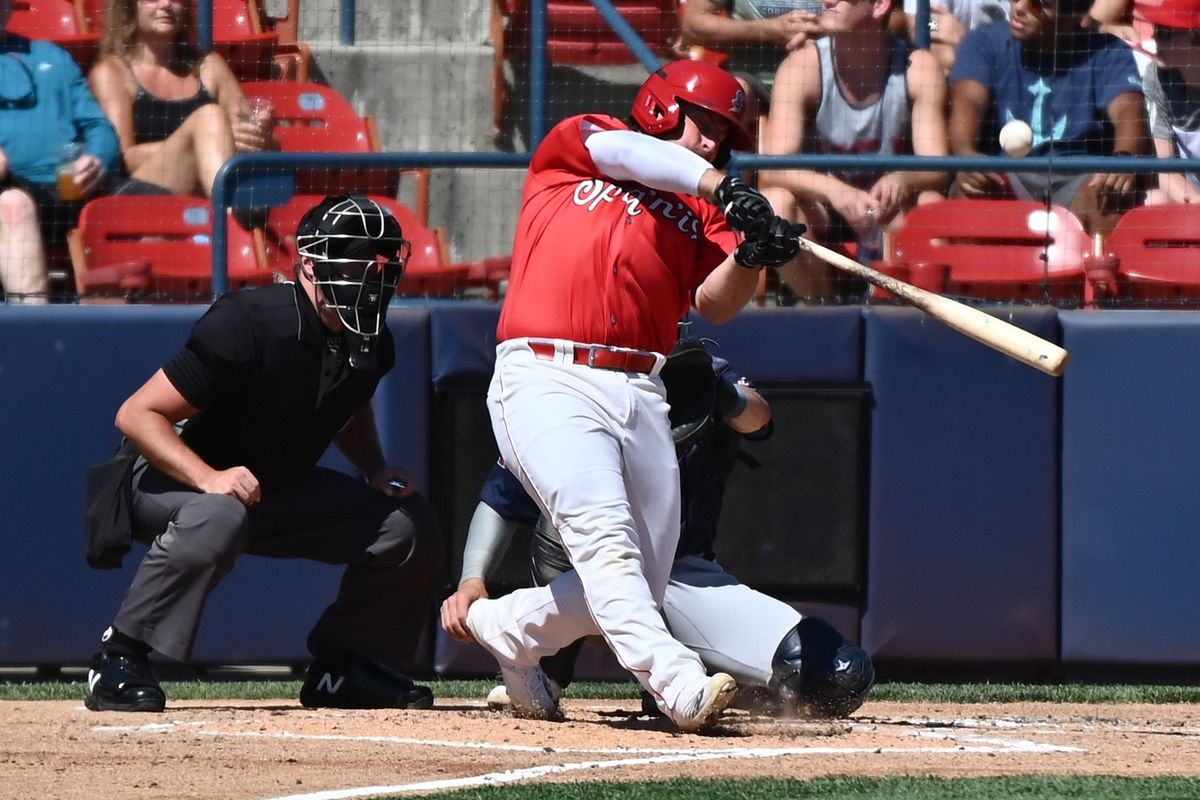 Spokane Indians catcher Colin Simpson (30) hits a three-run home run during a Northwest League game against the Tri-City Dust Devils on Sunday Aug. 21, 2022 in Spokane WA.  (James Snook/For The Spokesman-Review)