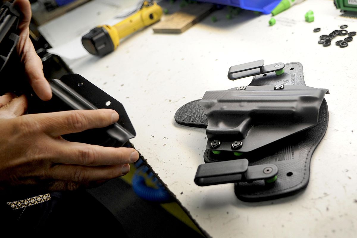Thomas Tedder, CEO of Tedder Industries, talks about the process of making the company’s  gun holsters and belts at the facility in Coeur d’Alene on Thursday, June 16, 2016. (Kathy Plonka / The Spokesman-Review)