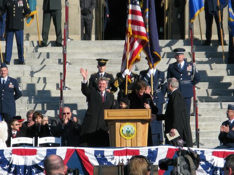 Idaho Gov. Butch Otter waves to the crowd after taking the oath of office at Friday's inaugural ceremonies; all state elected constitutional officials took oaths at the ceremony. (Betsy Russell)