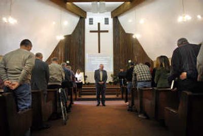 
Pastor Bob Warren leads the Colbert Chapel congregation in the opening prayer on the church's 100th year anniversary.  
 (Holly Pickett / The Spokesman-Review)