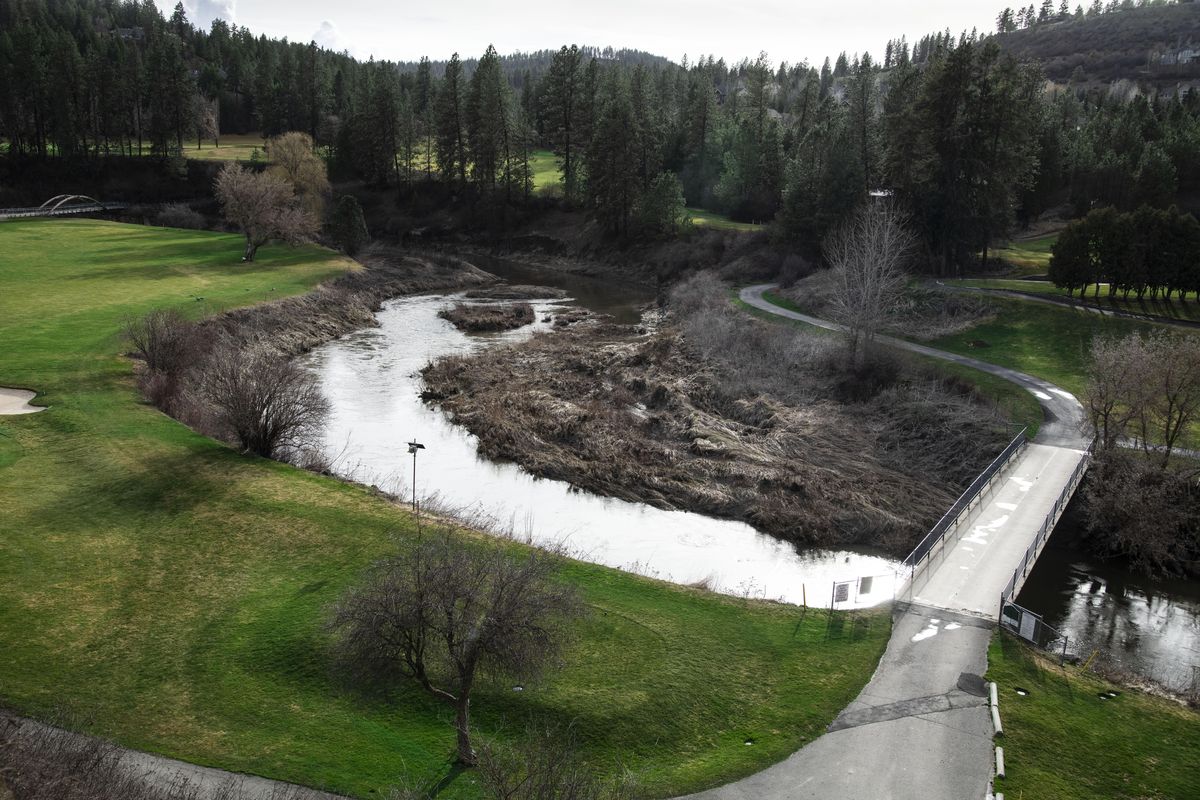 Murky brown water runs through Hangman Creek, also known as Latah Creek, at the Hangman Valley Golf Course south of Spokane on Wednesday, April 3, 2019. The Washington Department of Ecology has awarded $15,000 to Spokane County’s parks department to plant native vegetation along the banks of the creek to prevent erosion that muddies the water and inhibits wildlife, including trout. (Colin Mulvany / The Spokesman-Review)