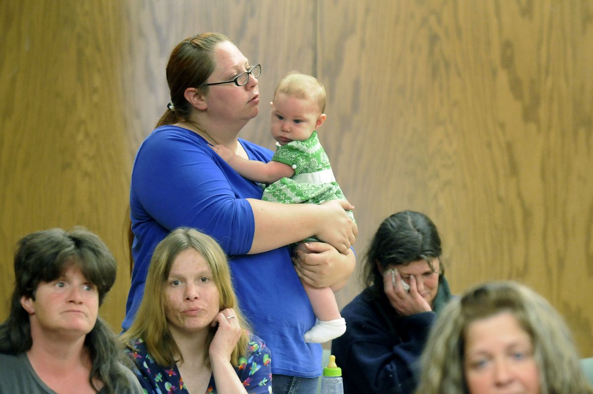 Clients of the Spokane Regional Health District methadone treatment program and their family members gathered Monday to talk about cuts to the program. From  left are Ann Ritchie and her sister Patricia Pemberton; Amanda Colin and her 6-month-old daughter, Alice Replogle; Sherrie Barnard and Tamara Martello.    (Dan Pelle / The Spokesman-Review)