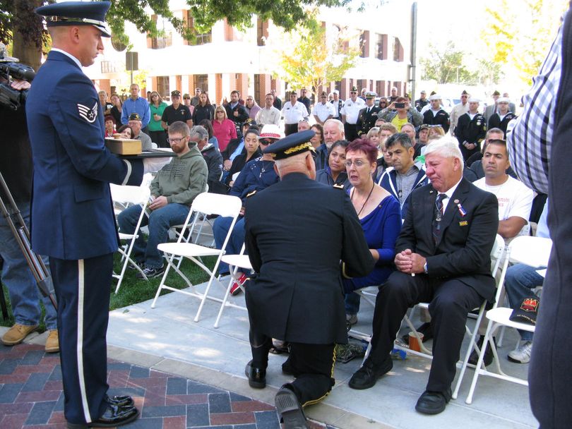 Jeannie and Bob Lyon, parents of Air Force Capt. David Lyon, are given a special presentation during Idaho's state 9/11 ceremony at the Idaho Fallen Soldier Memorial in Boise on Thursday (Betsy Russell)