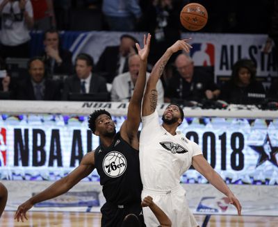 In this Feb. 18, 2018 photo, Team Stephen center Joel Embiid, left, of the Philadelphia 76ers. leaps for the tipoff won by Team LeBron forward Anthony Davis, of the New Orleans Pelicans, during the NBA All-Star basketball game in Los Angeles. The NBA has changed the format of its All-Star Game and basketball purists are skeptical. The betting industry is curious. The changes could spark more in-game betting, which is popular in Europe but not as much in the U.S. Or, perhaps bettors will sit this one out, unsure of what to expect. (Alex Gallardo / Associated Press)