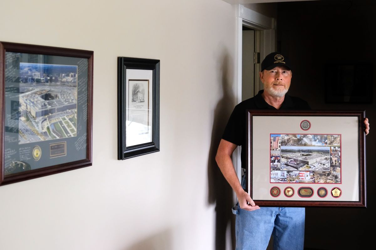 Jerry Warren, a 9/11 Pentagon survivor, poses for a photo on Wednesday with a shadow box given to him by Gen. Eric Shinseki, former chief of staff of the United States Army.  (Tyler Tjomsland/The Spokesman-Review)