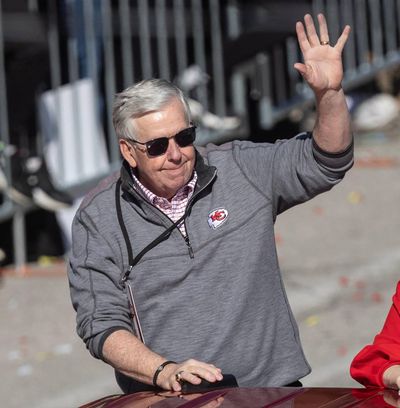 Missouri governor Mike Parson waves to the crowd during the Super Bowl parade on Wednesday.    (Travis Heying/The Wichita Eagle/The Wichita Eagle/TNS)