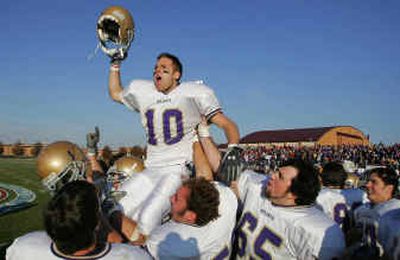 
Carroll College kicker Marcus Miller, a Gonzaga Prep grad, celebrates his NAIA championship game-winning field goal on the shoulders of his teammates Saturday.
 (Associated Press / The Spokesman-Review)