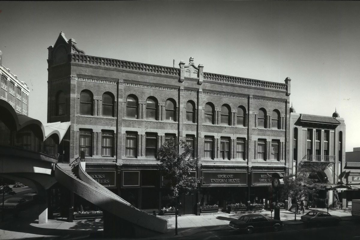 The Bennett Block, seen here in a 1980 photo at Main Ave. & Howard Street in downtown Spokane, was built by Bascomb H. Bennett after its predecessor was lost in the 1889 fire. The upstairs was a hotel for many years with retail stores on the ground floor. Bennett was a partner with his father-in-law, Anthony M. Cannon, a wealthy pioneer of the city. The skywalk at left was attached to the building in 1967. (The Spokesman-Review Photo Archive / SR)