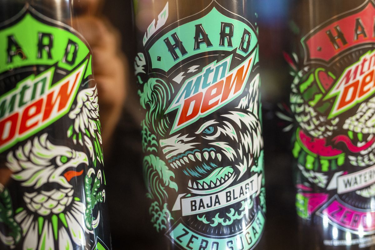 Cans of Hard MYN Dew sit on the shelf at a One Stop Wines and Spirits store in Johnson City, Tenn., earlier this month.  (MIKE BELLEME/New York Times)