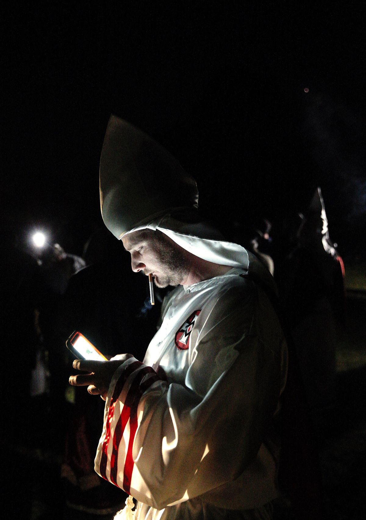 In this April 23, 2016, photo, members of the Ku Klux Klan participate in cross burnings after a “White Pride,” rally, in rural Paulding County near Cedar Town, Ga. (John Bazemore / Associated Press)