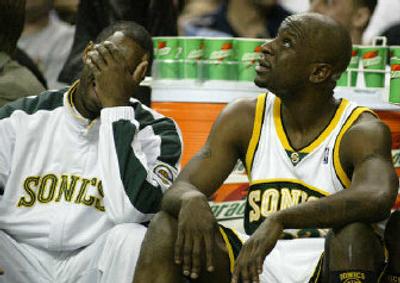 
Even Seattle's Mateen Cleaves, left, and Ronald Murray find the Sonics hard to watch this season.
 (Associated Press / The Spokesman-Review)