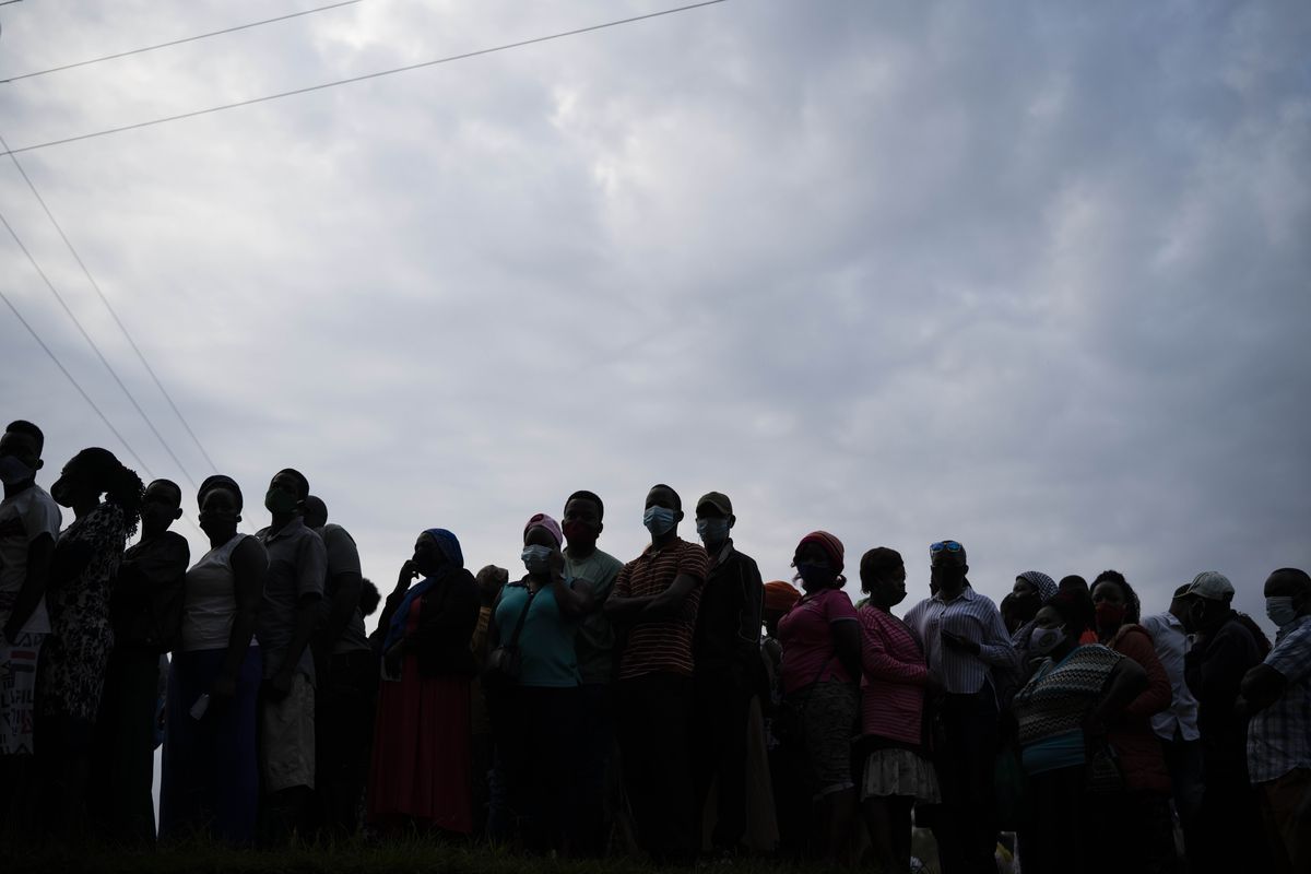 In this Thursday, Jan. 14, 2021 photo, Ugandans wait to cast their votes for the presidential election in Kampala, Uganda. Ugandan opposition leader Bobi Wine on Monday, Feb. 15, 2021 released a list of 243 people who have allegedly been abducted by the security forces, piling pressure on the government to find those missing amid continuing political tensions after last month