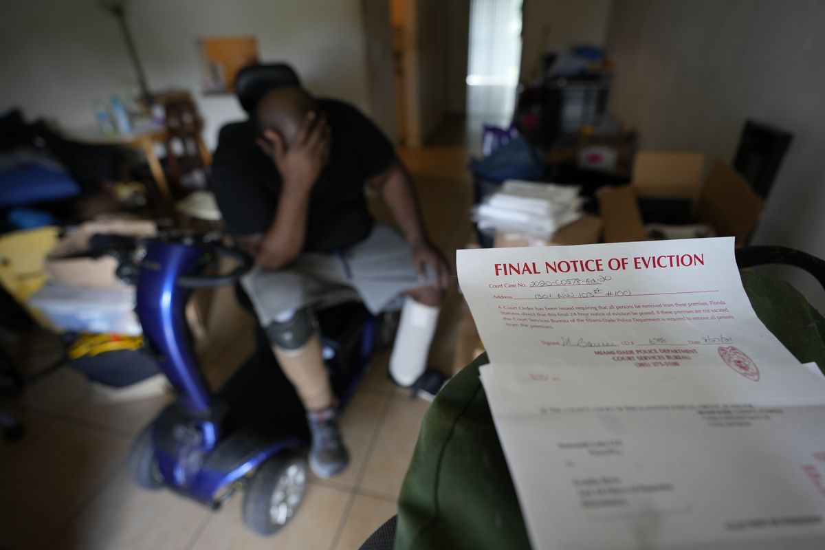 Freddie Davis, whose landlord raised his rent by 60 percent in the same month he lost his job as a truck driver, waits for a friend to arrive to help him move his remaining belongings to a storage unit, after receiving a final eviction notice at his one-bedroom apartment, Wednesday, Sept. 29, 2021, in Miami. "I never thought I