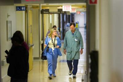 
Rapid-response team members Denise Sargent, a nurse,  and Harry Lebsock, a respiratory therapist, walk the halls of Sacred Heart  Medical Center last week. 
 (CHRISTOPHER ANDERSON / The Spokesman-Review)