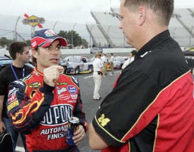 
Jeff Gordon, left, talks to his crew chief, Steve Letarte, after his run at Martinsville Speedway on Friday. Associated Press
 (Associated Press / The Spokesman-Review)