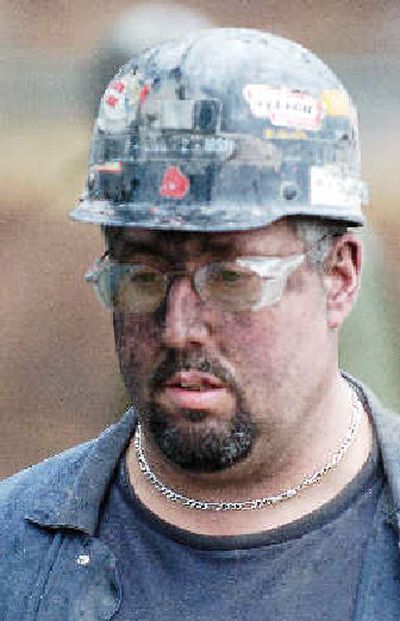 
Miner Alton Wansley leaves the Tallmansville, W.Va., mine on Monday. Thirteen miners are still missing following an explosion. 
 (Associated Press / The Spokesman-Review)