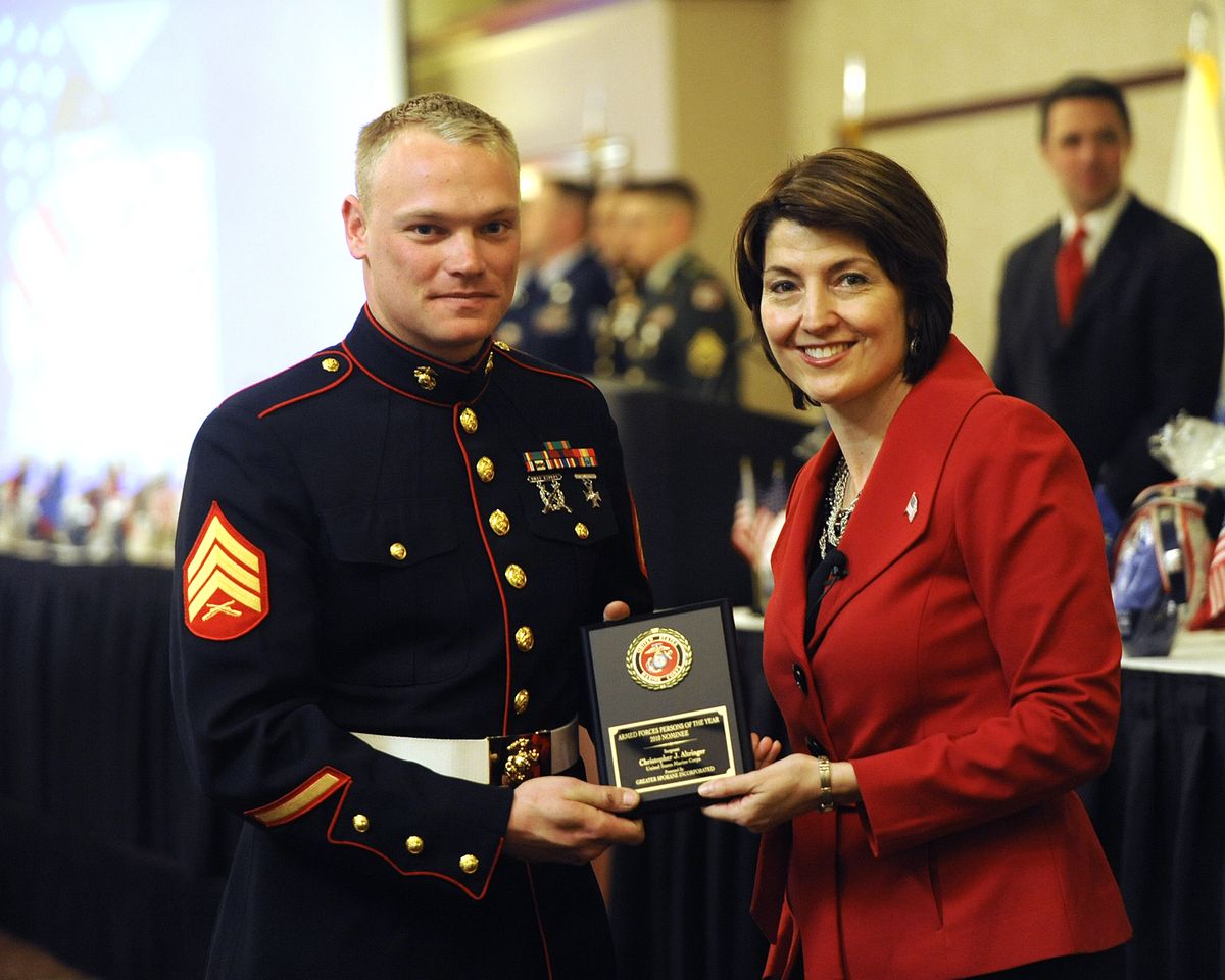 Sgt. Christopher Altringer of the U.S. Marine Corps receives a plaque indicating his nomination for Armed Services Person of the Year from Congresswoman Cathy McMorris Rodgers at a luncheon Tuesday, April 6, 2010, at the Doubletree Hotel in Spokane. (Jesse Tinsley / The Spokesman-Review)