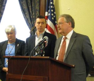House Minority Leader John Rusche, D-Lewiston, right, decries a "Legislature run amok" as he reflects Friday on this year's legislative session; at center is Minority Caucus Chair Brian Cronin, D-Boise; at left is Rep. Phylis King, D-Boise. (Betsy Russell)