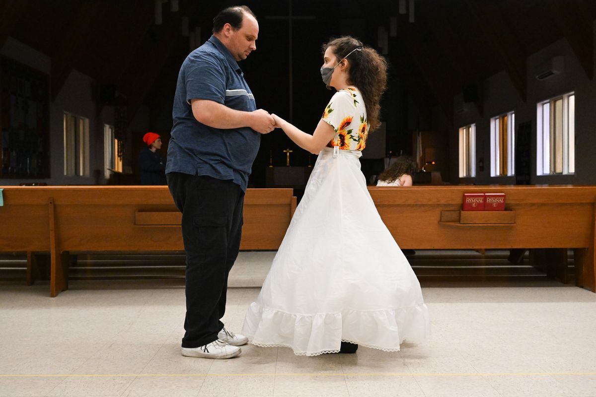 Brian Pearson, left, playing Beast, acts out a scene with Abigail Donnelly, right, who shares the role of Belle with Michelle Wheeler (not pictured) during a My Turn Theater rehearsal for the group’s upcoming production of “Beauty and the Beast Jr.” on April 11 at Highland Park United Methodist Church in Spokane.  (Tyler Tjomsland/The Spokesman-Review)